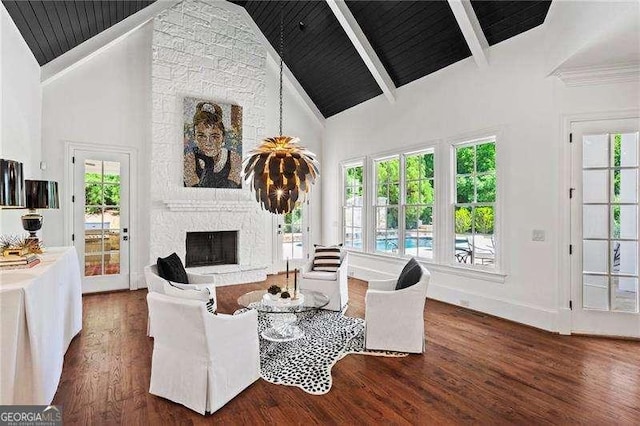 13922 Tree Loft Rd, Milton, GA 30004 - living room with beam ceiling, wood finished floors, high vaulted ceiling, baseboards, and a stone fireplace