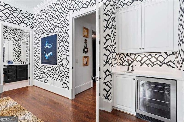 13922 Tree Loft Rd, Milton, GA 30004 - bar with beverage cooler, indoor wet bar, wallpapered walls, baseboards, and ornamental molding