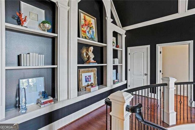 13922 Tree Loft Rd, Milton, GA 30004 - corridor with wood finished floors, built in features, and an upstairs landing