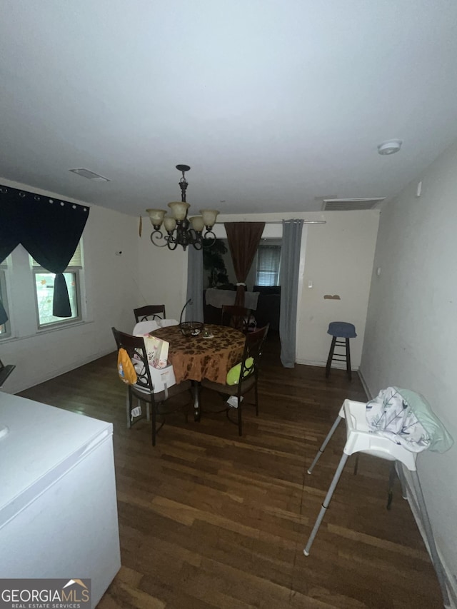 1621 Lee St, Brunswick, GA 31520 - dining area featuring wood finished floors and a chandelier
