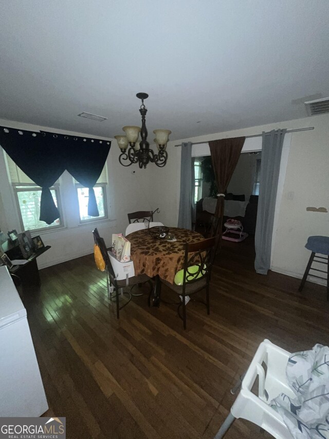 1621 Lee St, Brunswick, GA 31520 - dining room with wood finished floors and a chandelier