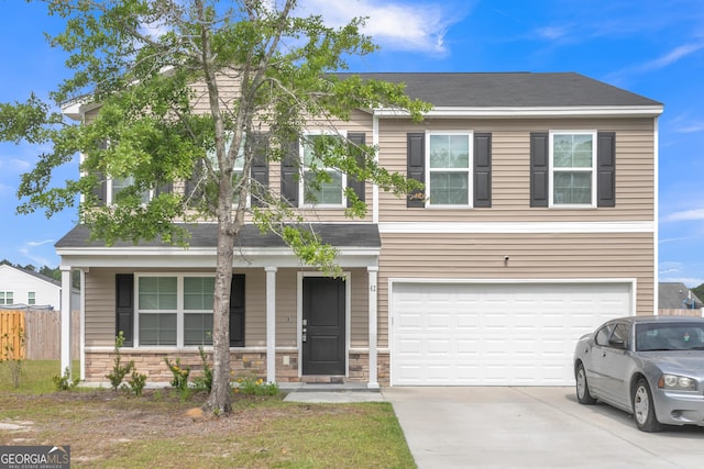 62 Blackberry Cir, Guyton, GA 31312 - view of front of property featuring a porch, fence, an attached garage, stone siding, and driveway