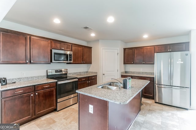 62 Blackberry Cir, Guyton, GA 31312 - kitchen with recessed lighting, light stone counters, appliances with stainless steel finishes, and a sink