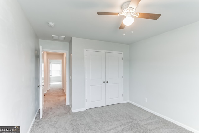 62 Blackberry Cir, Guyton, GA 31312 - unfurnished bedroom featuring baseboards, light carpet, a closet, and a ceiling fan