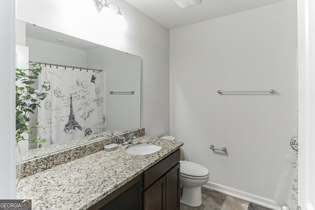 62 Blackberry Cir, Guyton, GA 31312 - full bath featuring toilet, baseboards, and vanity
