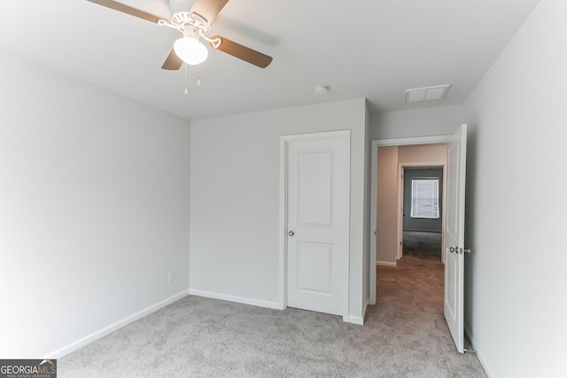 62 Blackberry Cir, Guyton, GA 31312 - unfurnished bedroom with light colored carpet, baseboards, ceiling fan, and visible vents