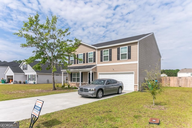62 Blackberry Cir, Guyton, GA 31312 - view of front facade featuring a front yard, driveway, fence, and a garage