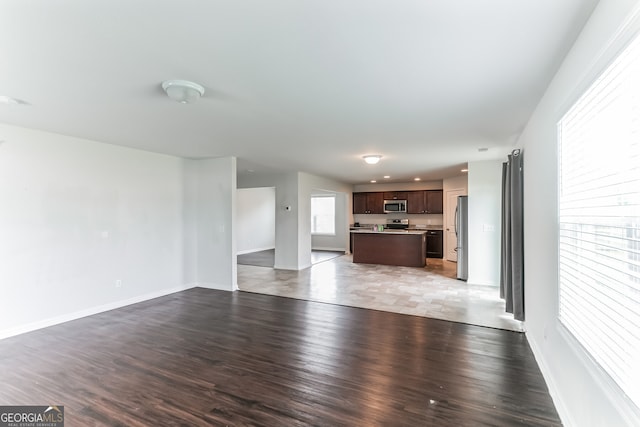 62 Blackberry Cir, Guyton, GA 31312 - unfurnished living room with baseboards and wood finished floors