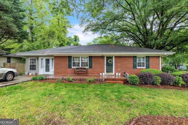 292 Lumpkin St, Winder, GA 30680 - single story home featuring a front yard, brick siding, and fence