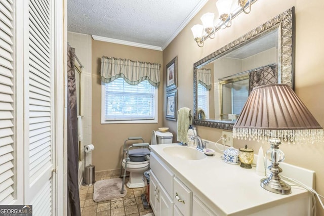292 Lumpkin St, Winder, GA 30680 - bathroom featuring toilet, a textured ceiling, baseboards, vanity, and ornamental molding
