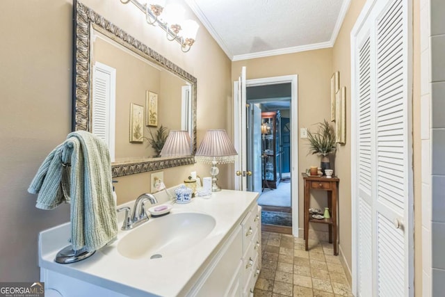 292 Lumpkin St, Winder, GA 30680 - bathroom featuring a closet, vanity, ornamental molding, stone finish floor, and baseboards