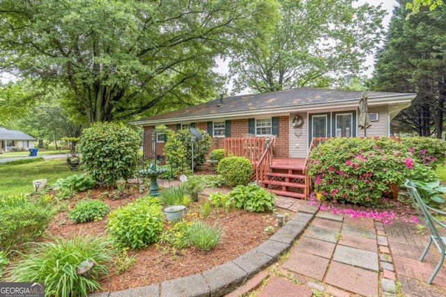 292 Lumpkin St, Winder, GA 30680 - ranch-style house featuring brick siding and a deck
