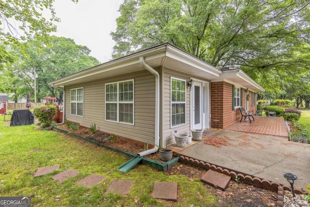 292 Lumpkin St, Winder, GA 30680 - view of property exterior with a yard, a deck, and fence