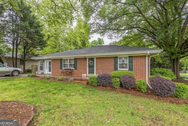 292 Lumpkin St, Winder, GA 30680 - ranch-style home featuring brick siding and a front yard
