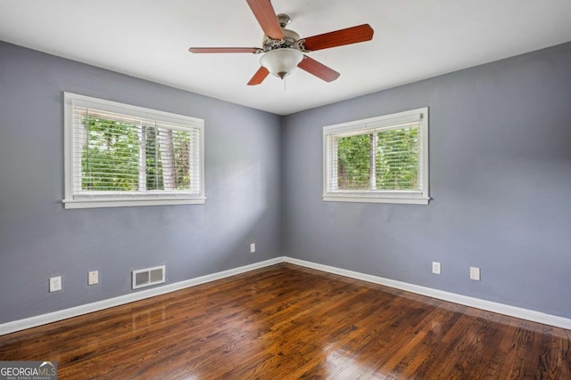 empty room with visible vents, baseboards, and a healthy amount of sunlight