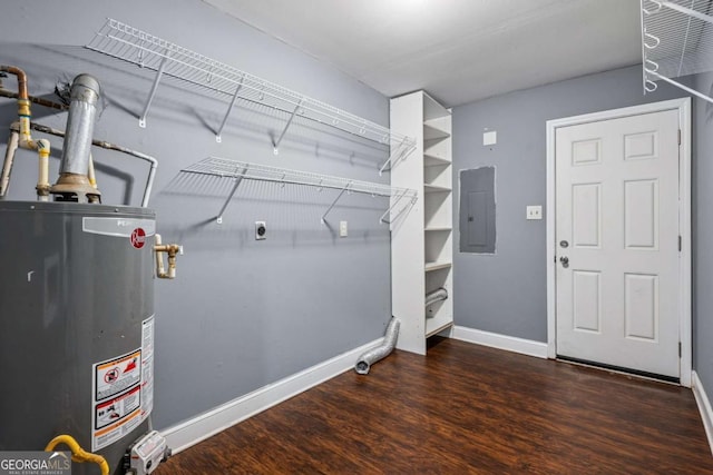 laundry area featuring wood finished floors, laundry area, hookup for an electric dryer, gas water heater, and electric panel