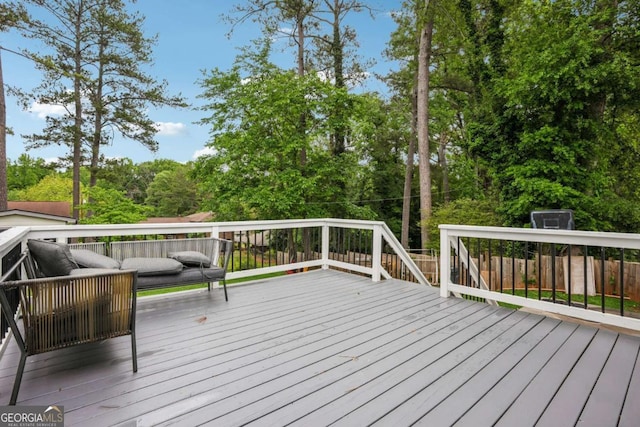 wooden deck featuring outdoor lounge area