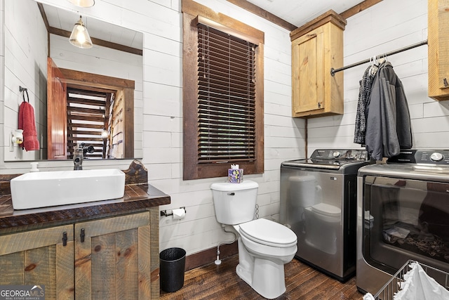 264 Pontoosuc Dr, Mineral Bluff, GA 30559 - bathroom with wood walls, toilet, independent washer and dryer, and wood finished floors