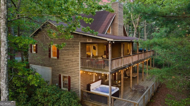 142 Amelia Ln, Blue Ridge, GA 30513 - back of property featuring a chimney and a deck