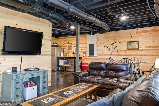 142 Amelia Ln, Blue Ridge, GA 30513 - living area featuring electric panel, wooden walls, and concrete flooring