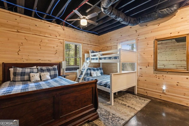142 Amelia Ln, Blue Ridge, GA 30513 - bedroom featuring wooden walls and concrete flooring