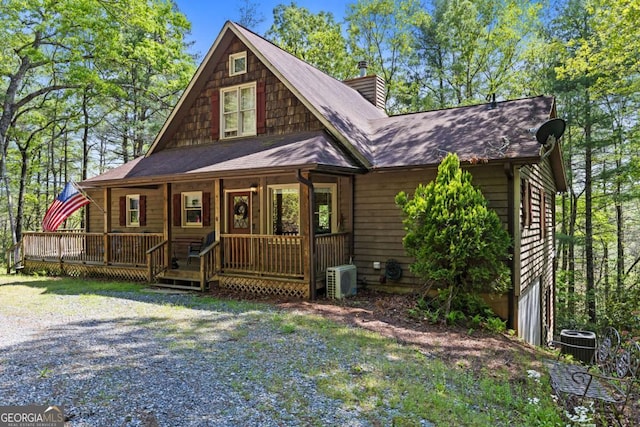 142 Amelia Ln, Blue Ridge, GA 30513 - view of front of home with covered porch, roof with shingles, cooling unit, ac unit, and a chimney