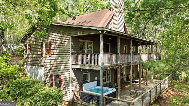 142 Amelia Ln, Blue Ridge, GA 30513 - rear view of house featuring a wooden deck and a chimney