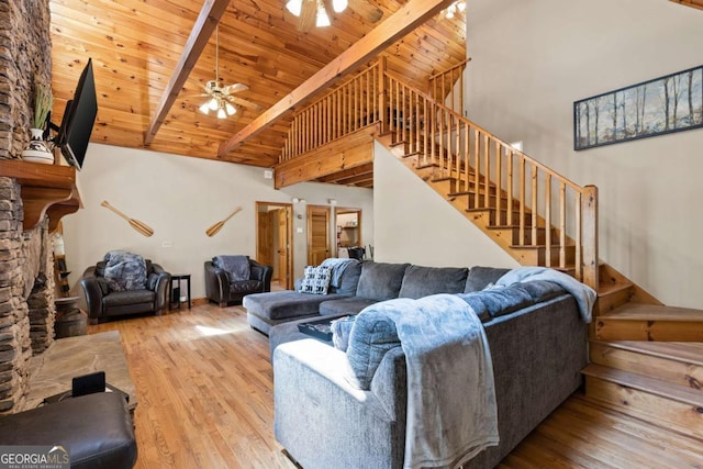 142 Amelia Ln, Blue Ridge, GA 30513 - living room with stairs, wood finished floors, beam ceiling, high vaulted ceiling, and a ceiling fan