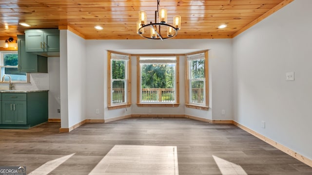 1297 Old Summerville Rd NW, Rome, GA 30165 - unfurnished dining area featuring wooden ceiling, a chandelier, light wood-type flooring, baseboards, and a sink