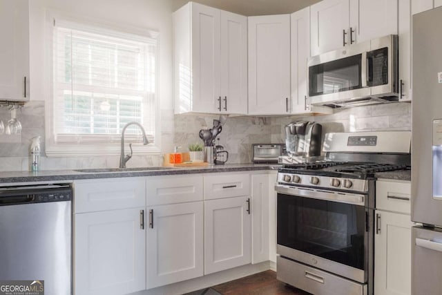 1893 Windsor Dr SW, Atlanta, GA 30311 - full bathroom featuring vanity, toilet, baseboards, and shower / bath combo
