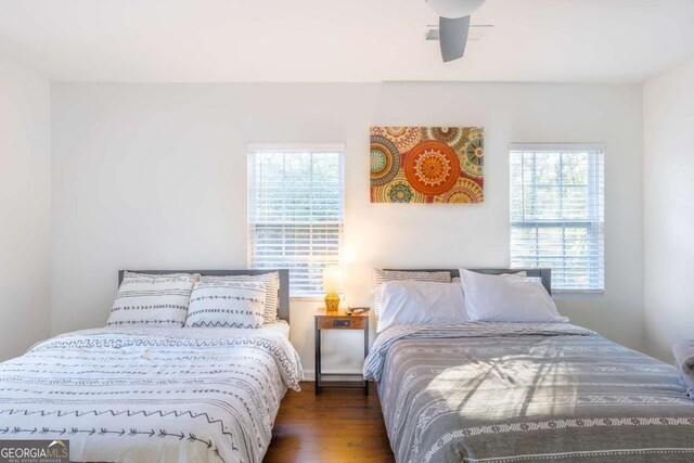 1893 Windsor Dr SW, Atlanta, GA 30311 - bedroom featuring multiple windows, wood finished floors, and baseboards