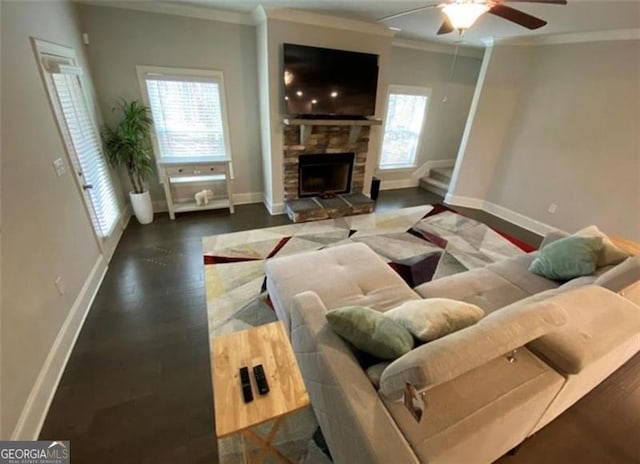 100 Ruby Ln, Mcdonough, GA 30252 - living area with crown molding, baseboards, a ceiling fan, a fireplace, and wood finished floors