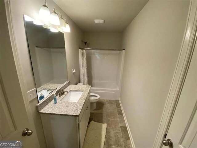 100 Ruby Ln, Mcdonough, GA 30252 - full bathroom with shower / tub combo, toilet, vanity, baseboards, and tile patterned floors