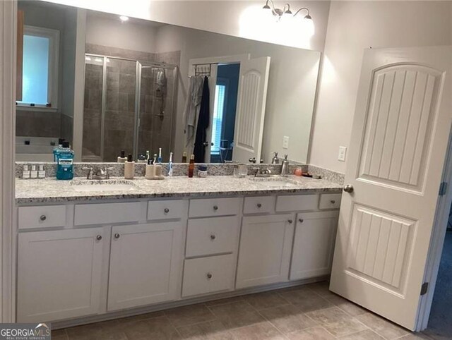 100 Ruby Ln, Mcdonough, GA 30252 - bathroom with a stall shower and double vanity