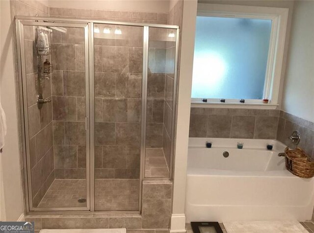 100 Ruby Ln, Mcdonough, GA 30252 - bathroom with a shower stall and a garden tub