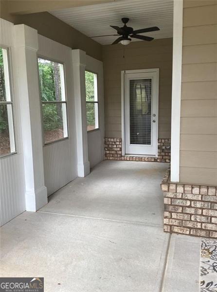 100 Ruby Ln, Mcdonough, GA 30252 - view of exterior entry with a ceiling fan and covered porch