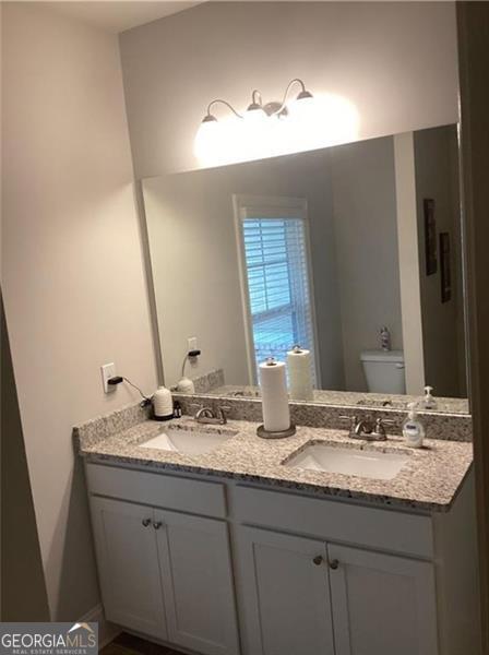 100 Ruby Ln, Mcdonough, GA 30252 - bathroom with toilet and double vanity