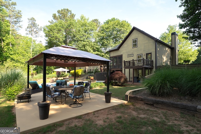 view of patio featuring a gazebo and an outdoor hangout area