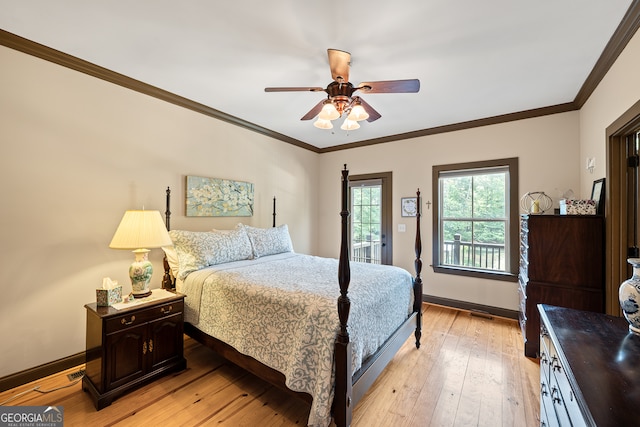 bedroom with crown molding, baseboards, light wood-style flooring, and ceiling fan