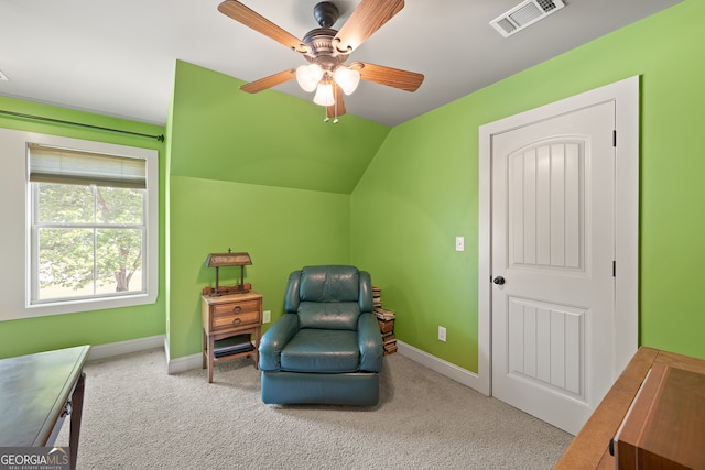 sitting room featuring carpet flooring, baseboards, a ceiling fan, and visible vents