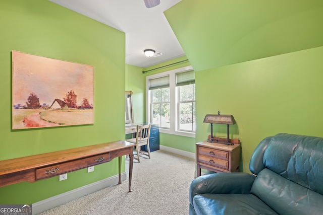 living area with baseboards and carpet flooring