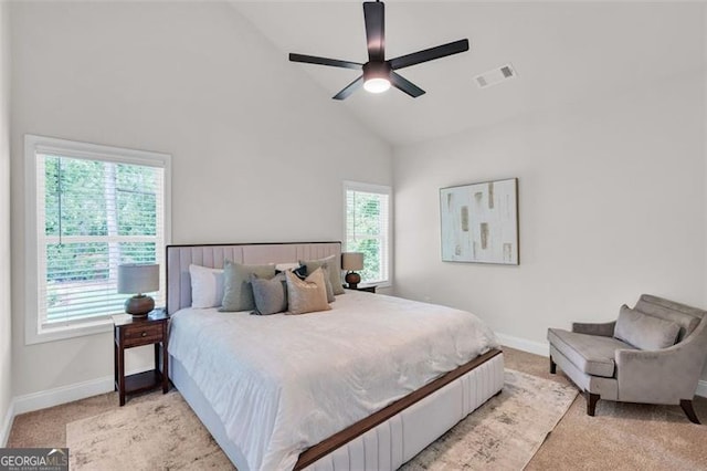 2621 Oldknow Dr NW, Atlanta, GA 30318 - bedroom featuring baseboards, visible vents, light colored carpet, and high vaulted ceiling