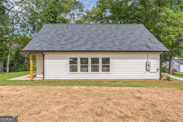 2621 Oldknow Dr NW, Atlanta, GA 30318 - back of property with a yard and roof with shingles