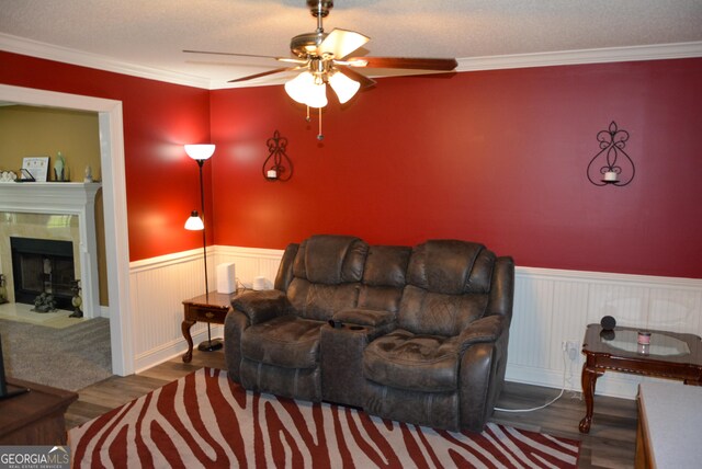 202 Willow Oak Way, Lizella, GA 31052 - living area with crown molding, wainscoting, ceiling fan, and wood finished floors