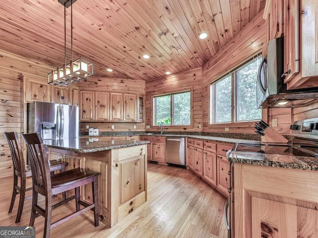550 My Mountain Rd, Morganton, GA 30560 - kitchen featuring appliances with stainless steel finishes, a kitchen breakfast bar, a center island, wooden ceiling, and light wood-style flooring