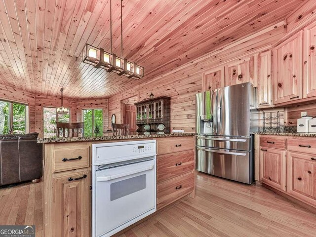 550 My Mountain Rd, Morganton, GA 30560 - kitchen featuring stainless steel fridge, oven, light brown cabinetry, open floor plan, and wood ceiling