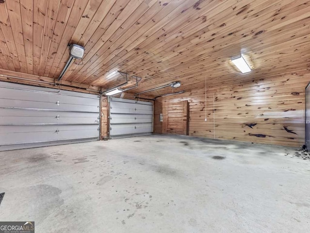 550 My Mountain Rd, Morganton, GA 30560 - garage featuring a garage door opener, wooden walls, and wood ceiling