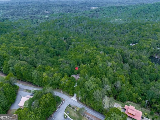 drone / aerial view featuring a view of trees