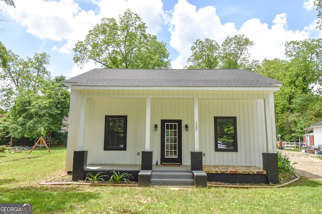 bungalow-style house with a front yard and a porch