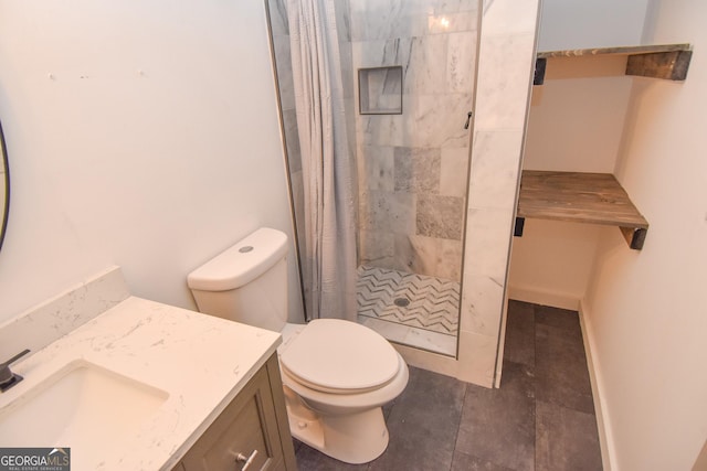 full bathroom with a stall shower, vanity, and toilet
